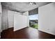 Modern bedroom with hardwood floors and large window with expansive city views at 3324 Peachtree Ne Rd # 2718, Atlanta, GA 30326