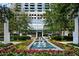 Elegant building exterior featuring lush landscaping and a calming water feature at 3324 Peachtree Ne Rd # 2718, Atlanta, GA 30326