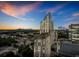 Aerial view of the city buildings with beautiful skyline at dusk at 3324 Peachtree Ne Rd # 2718, Atlanta, GA 30326