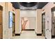 Hallway with elevators and modern decor in a bright, neutral color palette at 3324 Peachtree Ne Rd # 2718, Atlanta, GA 30326