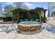 Outdoor stone fire pit with pergola and lounge seating, perfect for relaxing with city views at 3324 Peachtree Ne Rd # 2718, Atlanta, GA 30326