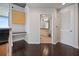 This kitchenette features granite counters, wood floors, and custom cabinets at 3324 Peachtree Ne Rd # 2718, Atlanta, GA 30326