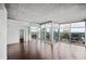 Bright open-concept living and dining area featuring hardwood floors and a stunning city view at 3324 Peachtree Ne Rd # 2718, Atlanta, GA 30326