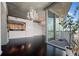 Open-concept living area with dark hardwood floors, a chandelier, and sliding glass door to a balcony at 3324 Peachtree Ne Rd # 2718, Atlanta, GA 30326