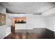 Spacious open-concept living area with dark floors and a view of the kitchen at 3324 Peachtree Ne Rd # 2718, Atlanta, GA 30326