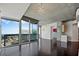 Bright living room with floor-to-ceiling windows, hardwood floors, and access to a balcony at 3324 Peachtree Ne Rd # 2718, Atlanta, GA 30326