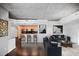 Bright, open-concept space with modern furniture, dark floors, and a view of the kitchen at 3324 Peachtree Ne Rd # 2718, Atlanta, GA 30326