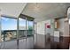 Bright open-concept living area with hardwood floors and sliding glass doors to a balcony at 3324 Peachtree Ne Rd # 2718, Atlanta, GA 30326