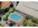 Aerial view of a pristine outdoor swimming pool with ample seating and manicured landscaping at 3324 Peachtree Ne Rd # 2718, Atlanta, GA 30326