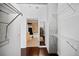 A look into a walk-in closet and bathroom featuring a tub and updated features at 3324 Peachtree Ne Rd # 2718, Atlanta, GA 30326