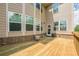 Spacious back deck with brick trim overlooking a large, private yard and trees at 5515 Cheatam Ave, Cumming, GA 30040
