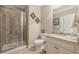 Modern bathroom with a glass-enclosed shower, granite countertop vanity, and neutral color scheme at 5515 Cheatam Ave, Cumming, GA 30040