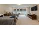 Bedroom featuring lots of natural light, beds, and a TV for entertainment at 5515 Cheatam Ave, Cumming, GA 30040