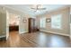 Bedroom featuring hardwood floors, neutral walls, and ceiling fan at 5515 Cheatam Ave, Cumming, GA 30040