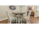 Casual dining area with stylish decor and hardwood floors, perfect for everyday meals at 5515 Cheatam Ave, Cumming, GA 30040
