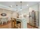 Gourmet kitchen with stainless steel appliances, granite countertops, and a cozy breakfast nook at 5515 Cheatam Ave, Cumming, GA 30040