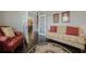Cozy living room featuring hardwood floors, french doors, and comfortable seating with decorative pillows at 5515 Cheatam Ave, Cumming, GA 30040
