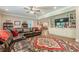 Spacious living room boasts a large leather sectional, built-in shelves, and hardwood floors at 5515 Cheatam Ave, Cumming, GA 30040