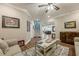 Well-decorated living room with hardwood floors, artwork and stairs leading upstairs at 5515 Cheatam Ave, Cumming, GA 30040