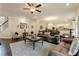 Open living space with hardwood floors, plenty of natural light and views into the modern kitchen at 5515 Cheatam Ave, Cumming, GA 30040