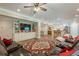 Spacious living area with hardwood floors, TV and open-concept kitchen at 5515 Cheatam Ave, Cumming, GA 30040