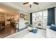 Inviting living room featuring hardwood floors, abundant natural light, and an open layout connecting to the kitchen at 5515 Cheatam Ave, Cumming, GA 30040