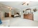 Spacious main bedroom with sitting area, tray ceilings, and dual dressers, providing ample storage at 5515 Cheatam Ave, Cumming, GA 30040