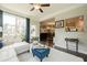 Comfortable sunroom featuring large windows, hardwood floors, and stylish decor at 5515 Cheatam Ave, Cumming, GA 30040