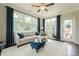 Inviting sunroom with lots of natural light, hardwood flooring, and cozy furniture at 5515 Cheatam Ave, Cumming, GA 30040