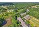 Bird's eye view of community near pond and surrounding forest at 1950 Buford Dam Rd # 205, Cumming, GA 30041