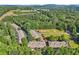 Aerial view showcasing this community nestled within lush greenery and wooded area at 1950 Buford Dam Rd # 205, Cumming, GA 30041