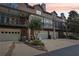 Townhome featuring private balconies, ground level garages and a well kept lawn at 1950 Buford Dam Rd # 205, Cumming, GA 30041