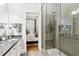 Nicely appointed bathroom featuring a walk-in shower and a view to the main bedroom at 1950 Buford Dam Rd # 205, Cumming, GA 30041