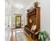 Inviting entryway with decorative glass door, hardwood floors, and hall tree at 1950 Buford Dam Rd # 205, Cumming, GA 30041