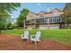 Beautiful multi-level brick home with garage and backyard seating on a well-manicured lawn at 1950 Buford Dam Rd # 205, Cumming, GA 30041