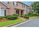 Charming brick townhome with a landscaped front yard and covered entryway at 1950 Buford Dam Rd # 205, Cumming, GA 30041