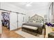 Stylish main bedroom featuring sliding barn doors to a walk-in closet and bathroom at 1950 Buford Dam Rd # 205, Cumming, GA 30041