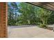 View from the parking area showcases the lush greenery surrounding the property at 1950 Buford Dam Rd # 205, Cumming, GA 30041