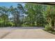 Parking area surrounded by mature trees and landscaping, offering a tranquil setting at 1950 Buford Dam Rd # 205, Cumming, GA 30041