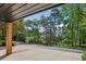 View from the parking area shows mature trees, and manicured landscaping at 1950 Buford Dam Rd # 205, Cumming, GA 30041