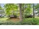 The backyard features lush greenery and mature trees that provides a serene outdoor space at 3627 Spring Meadow Court, Acworth, GA 30101
