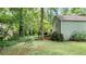Spacious backyard with lush landscaping and mature trees, great for outdoor activities and relaxation at 3627 Spring Meadow Court, Acworth, GA 30101