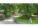 Charming home on a tree-lined street, featuring a two-car garage and a cozy front porch at 3627 Spring Meadow Court, Acworth, GA 30101