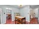 Bright eat-in kitchen features cherry floors, a butcher block island, and view into the dining room at 3627 Spring Meadow Court, Acworth, GA 30101