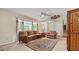 Bright living room with a bay window, a ceiling fan, and a decorative area rug at 3627 Spring Meadow Court, Acworth, GA 30101