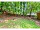 Spacious backyard with mature trees, and well-maintained lawn, offering shade and privacy at 379 Utoy Sw Cir, Atlanta, GA 30331