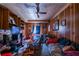 Cozy bedroom featuring wood paneling, ceiling fan, and natural light from the window at 379 Utoy Sw Cir, Atlanta, GA 30331