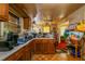 An eat-in kitchen featuring wood cabinetry and a dining table set with chairs at 379 Utoy Sw Cir, Atlanta, GA 30331