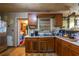 A kitchen features wood cabinets and a double basin sink with a window view at 379 Utoy Sw Cir, Atlanta, GA 30331