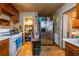 A compact kitchen featuring white appliances and access to the pantry in the home at 379 Utoy Sw Cir, Atlanta, GA 30331
